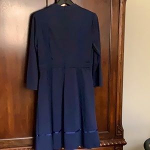 Navy blue long sleeve ladies dress.